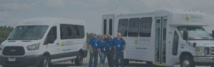 Kiessling Transit Operations Team Standing in Front of KTI Vehicles - About Us Title Background